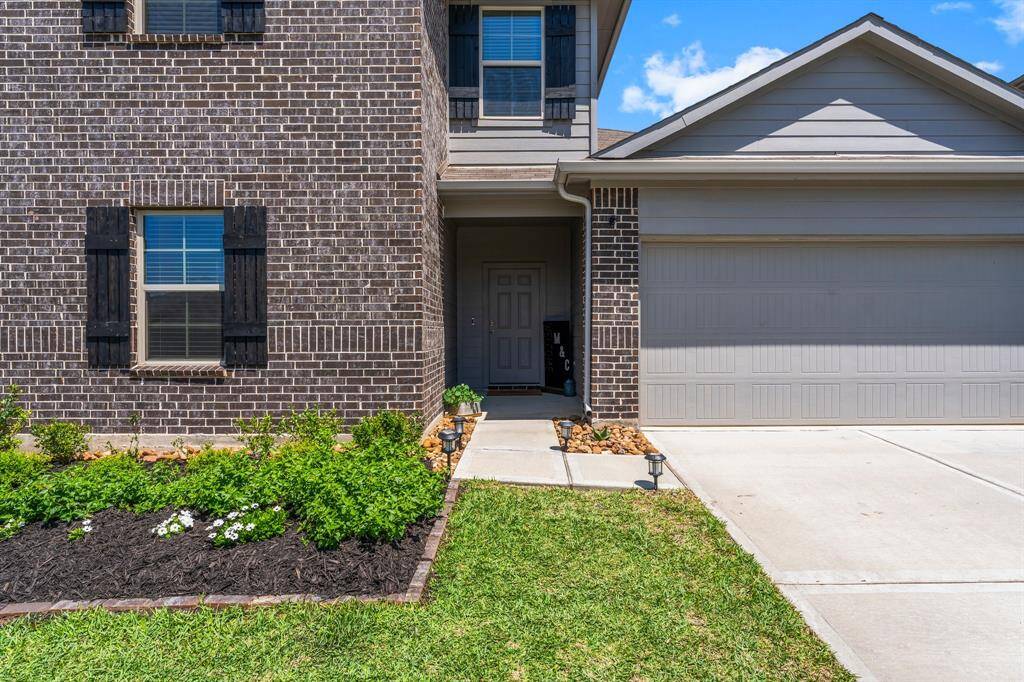 Beautiful brick exterior, covered front entrance, and beautiful landscaping make this home stand out!