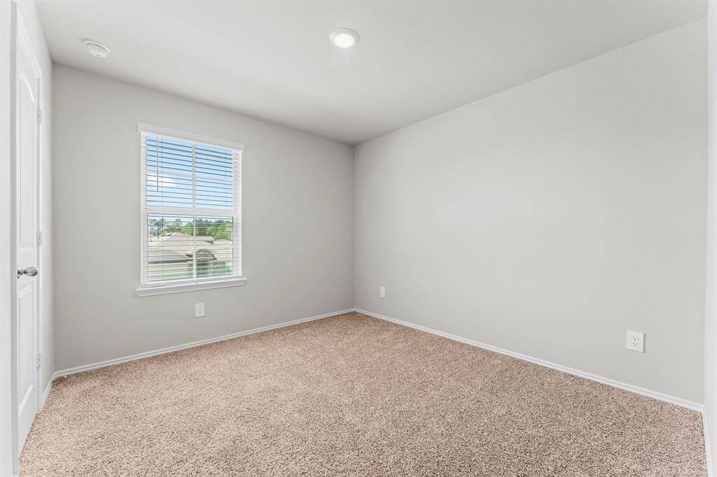 Second floor bedroom #4 is filled with natural light.