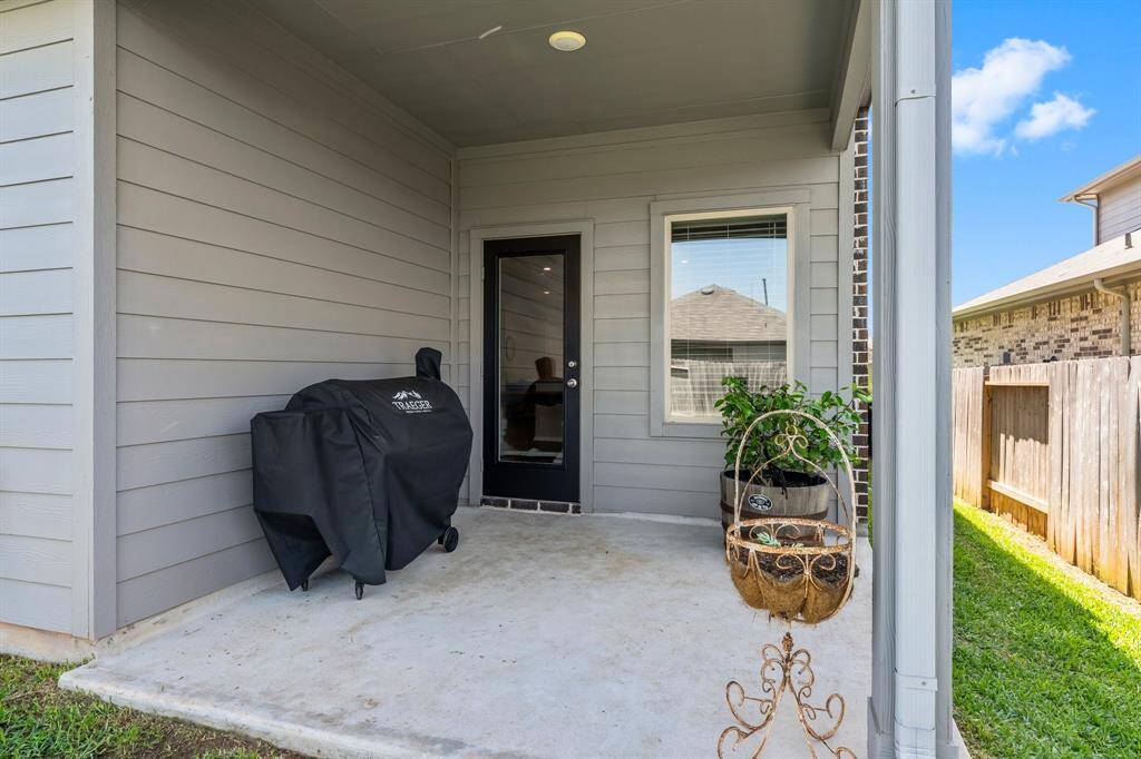 Covered patio for grilling and entertaining.