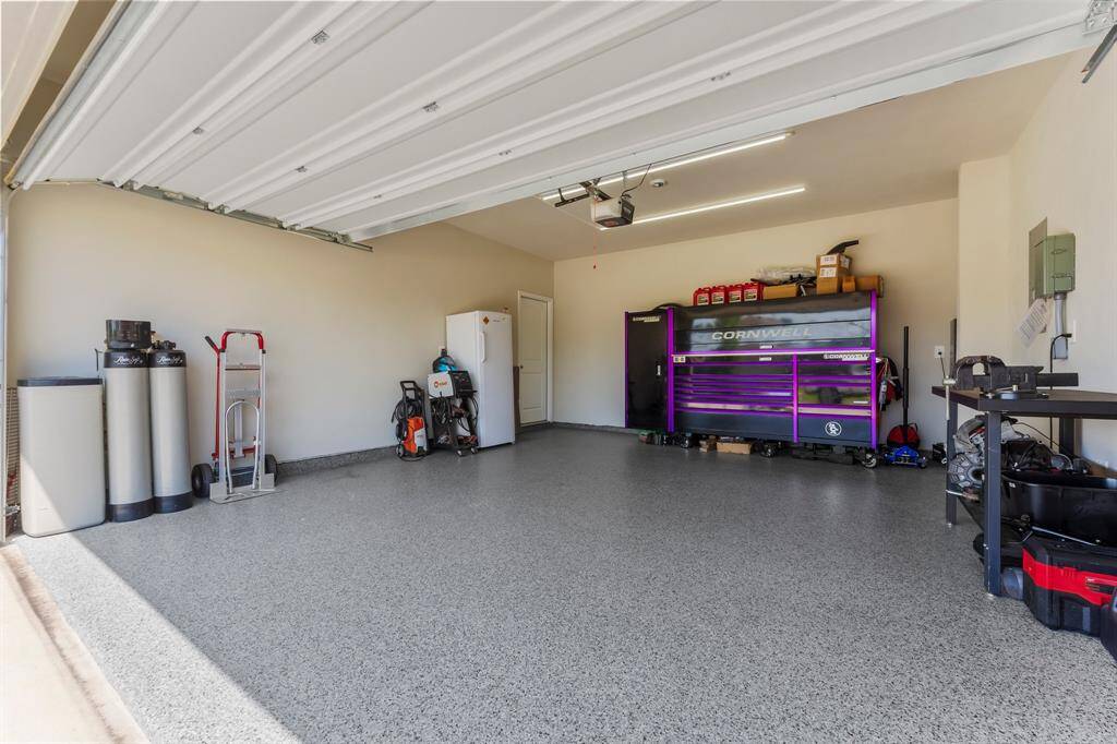 The garage has been updated with new LED lighting and epoxy flooring.