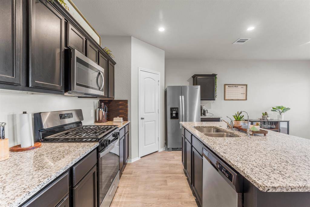 This kitchen has a large pantry with plenty of storage.