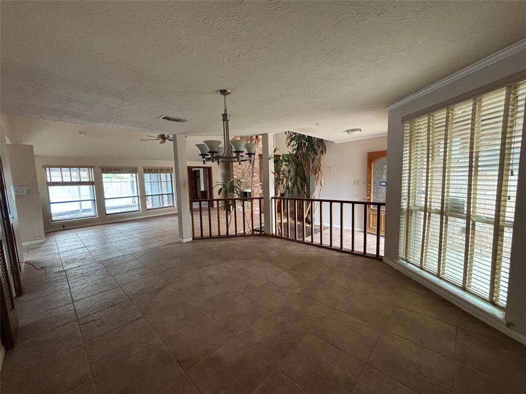 Your formal dining room overlooks your spacious dining room and boast of windows galore. Can we talk about the lighting? It is just gorgeous!