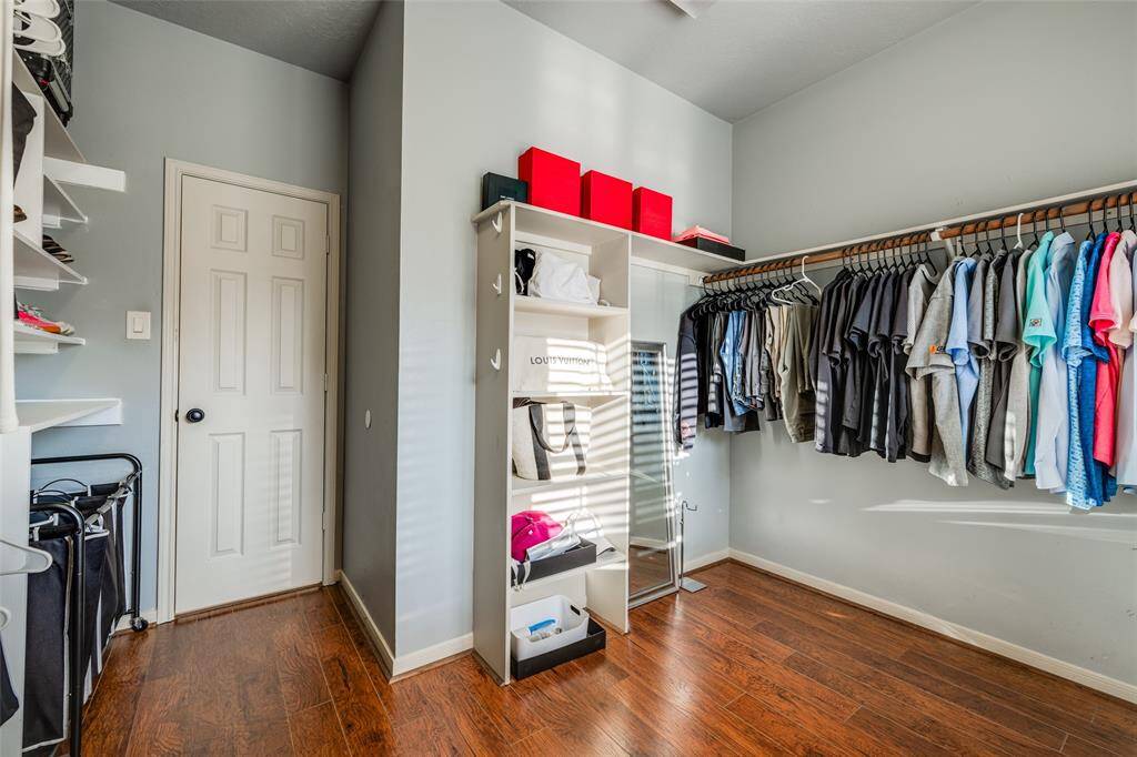 The walk in closet in the primary bath