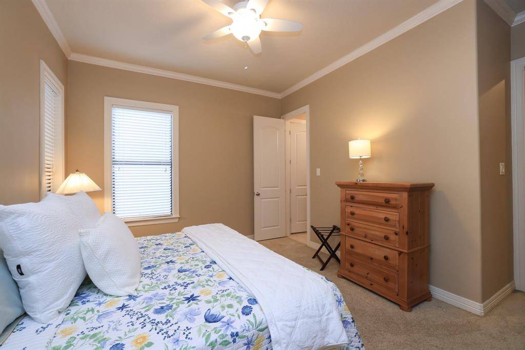 As with all rooms in the house, this bedroom also has crown molding which establishes a clean, finished look!  Also included is a large walk in closet (not pictured).  The full size bath is through the open door!