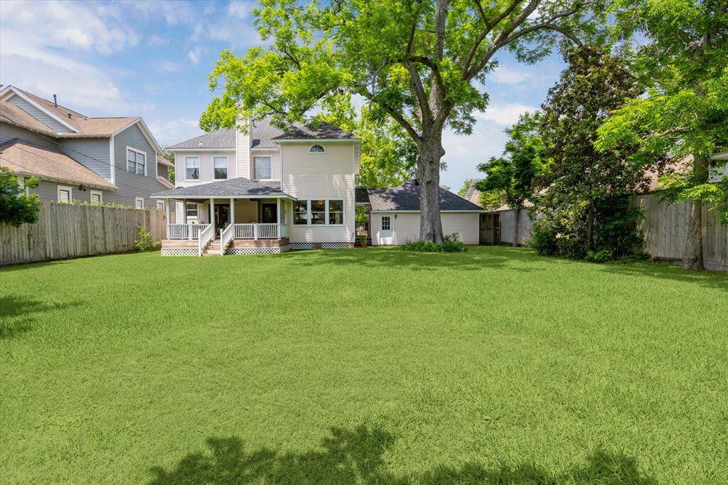 The backyard is truly a WOW factor, offering endless potential. It features abundant wildlife, including a variety of birds, mature trees, lush grass, and plenty of room to play.