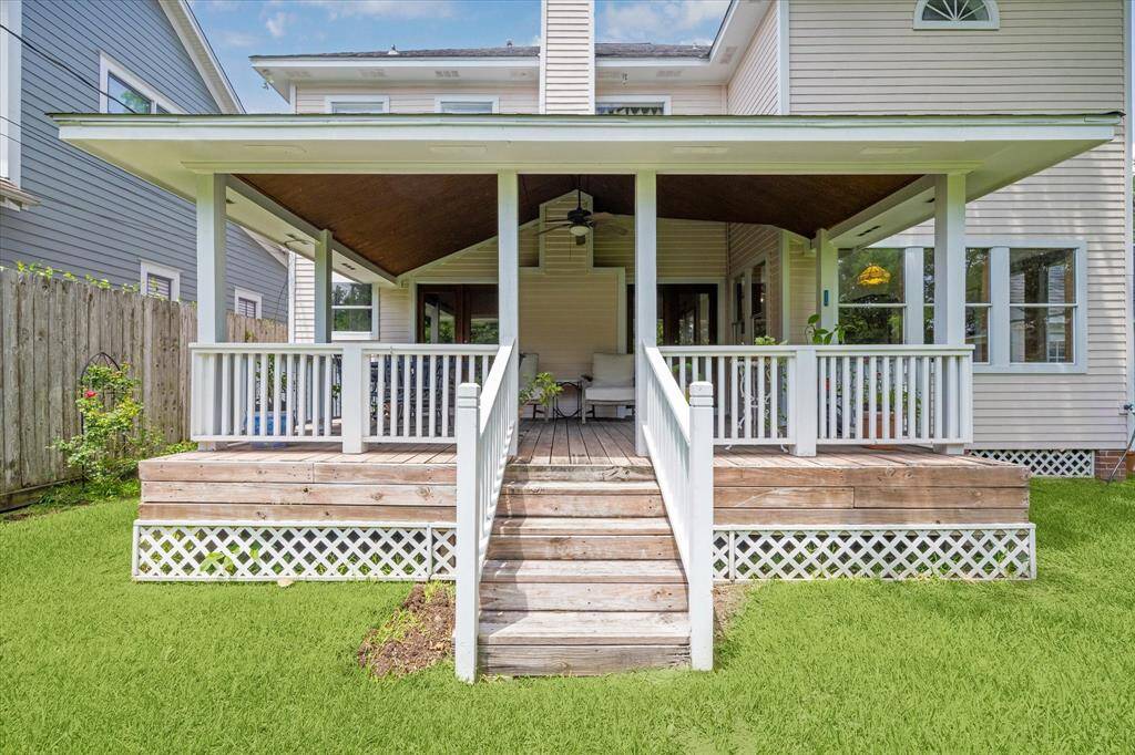A close-up shot of the back porch reveals an extended living area that is fully covered and perfect for relaxation.