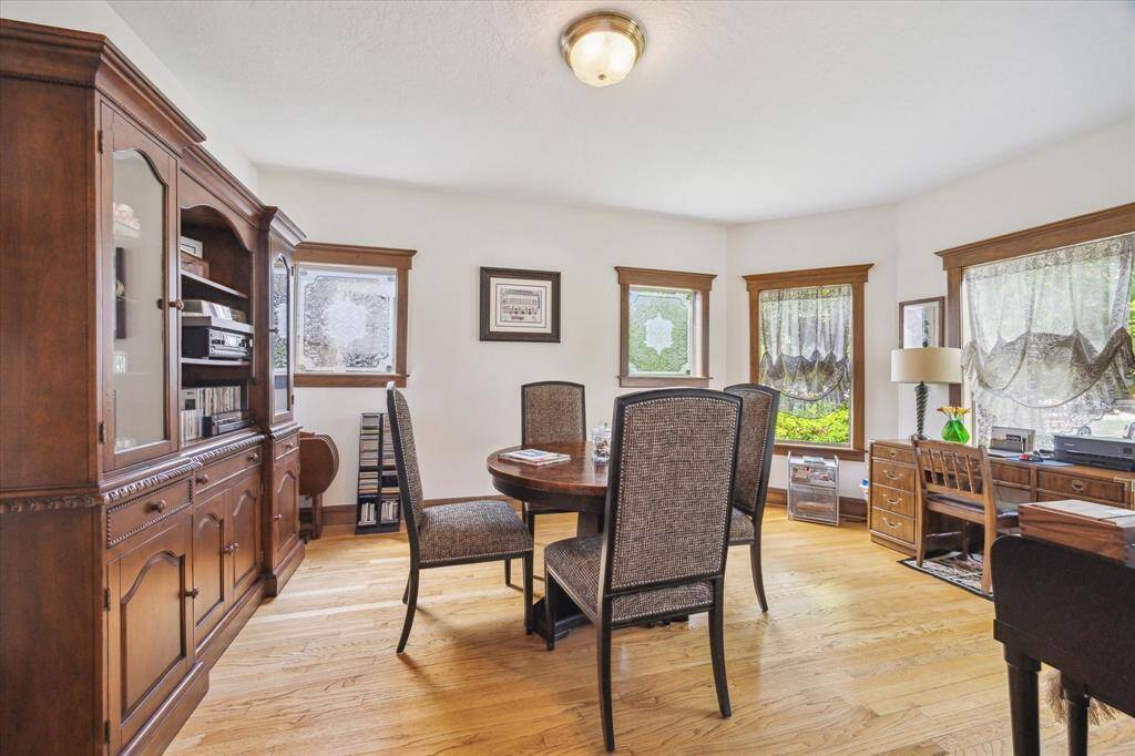 Located on the south side of the central hall, the designated office features ample windows, hardwood floors, and exquisite custom trim.