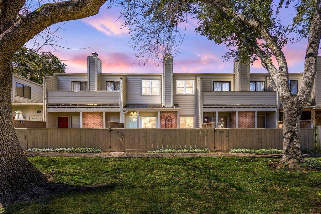 Welcome home to 1629 Prairie Grove Dr, situated in a private, gated townhome community of Walkers Mark and zoned to HISD. This inviting property showcases partial brick and wood siding, a fenced front courtyard, and a bright front door with an arch-window detail. Step through the gate to a cozy covered entry—perfect for sipping morning coffee or unwinding in the evening—and experience the best in comfort and style!