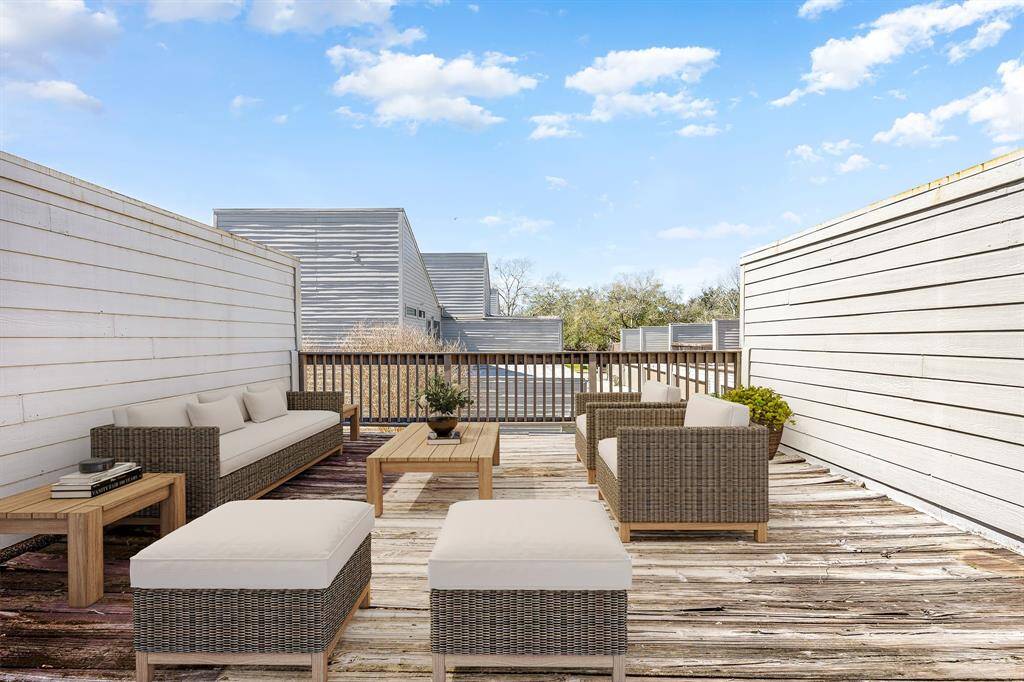Embrace the outdoors on this expansive rooftop-style deck—perfect for sunbathing, morning coffee, or gathering with friends for a weekend cookout. Enjoy plenty of space for stylish seating areas and take in the elevated view of the surrounding community. *Virtually Staged