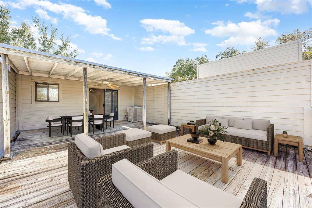 Extend your living area to this partially covered patio, offering a cool retreat. Whether hosting friends or enjoying a quiet evening under the stars, this versatile space seamlessly blends comfort and open-air living. *Virtually Staged