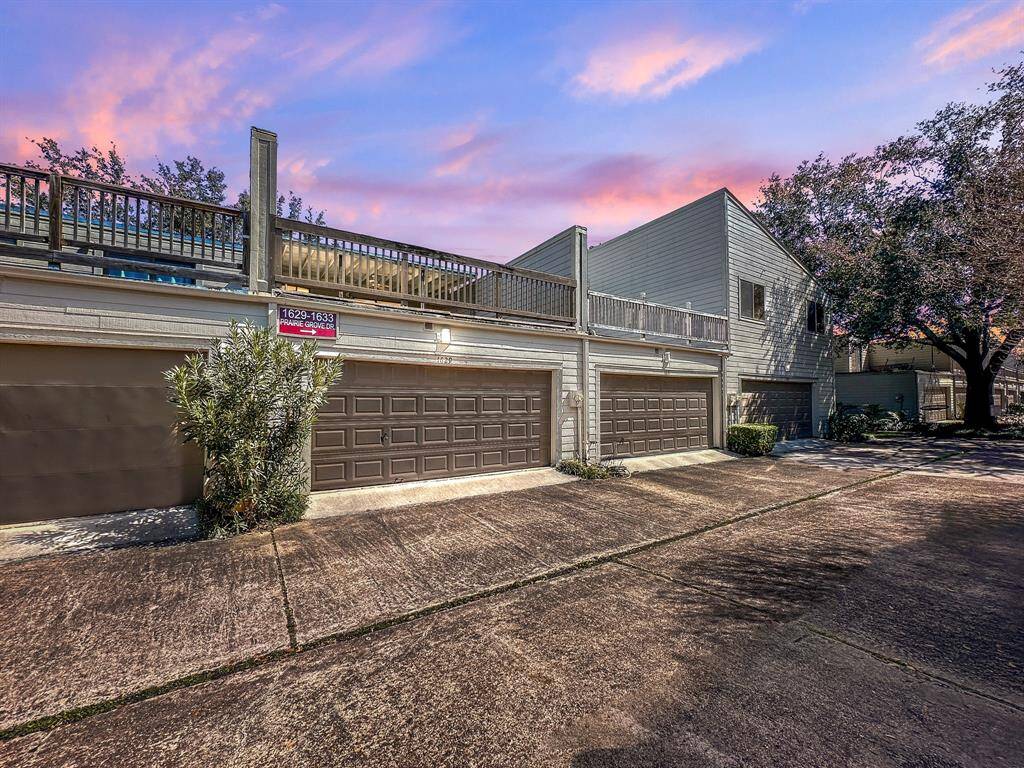 Enjoy secure, private parking in the two-car garage with a spacious rooftop deck above, providing both convenience and an additional outdoor living area.