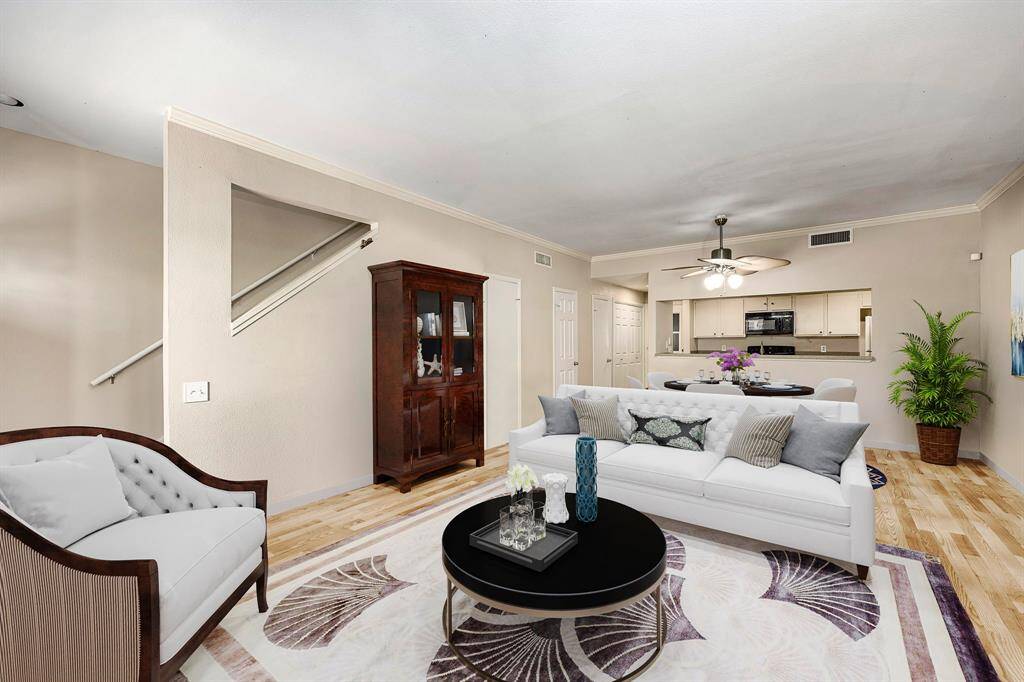 Gather the family and guests together in your lovely living room! Featuring high ceilings, custom paint, gorgeous wood style floors and large windows that provide plenty of natural lighting throughout the day. *Virtually Staged