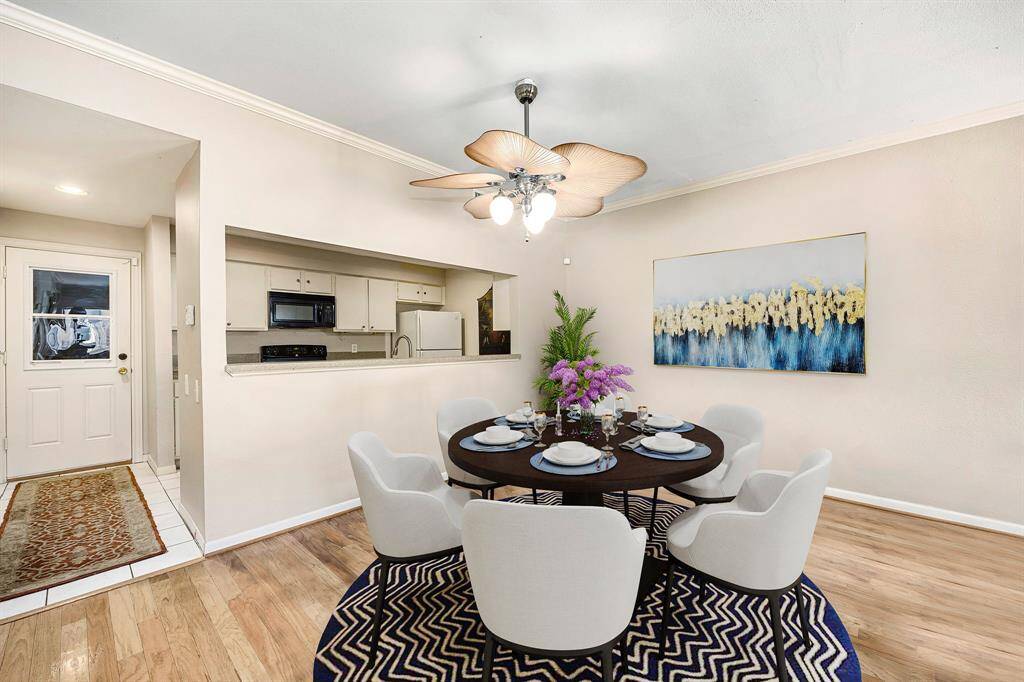 Make memories gathered around the table with your family and friends! This dining room features high ceilings, a beautiful ceiling fan with lighting, and wood style floors. *Virtually Staged
