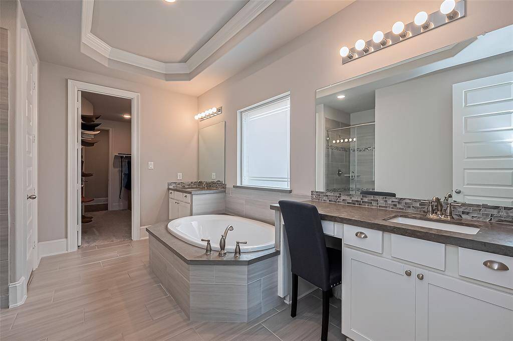 Primary bathroom connected to primary walk-in closet