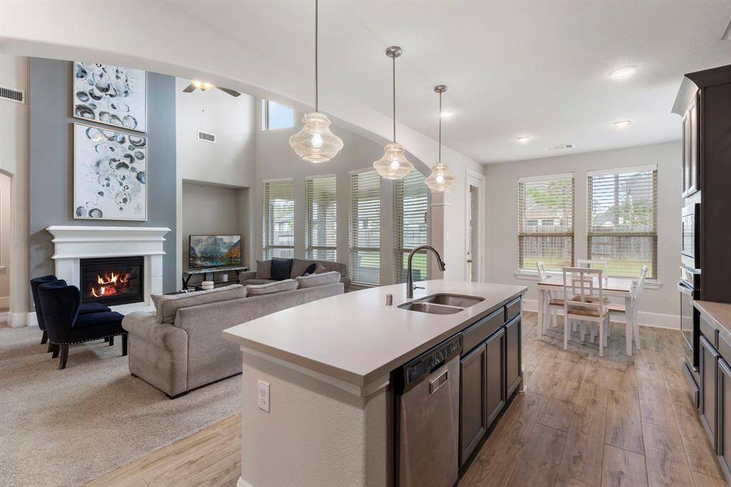 While tidying up in the kitchen, you can effortlessly stay connected with those unwinding in the Family room.