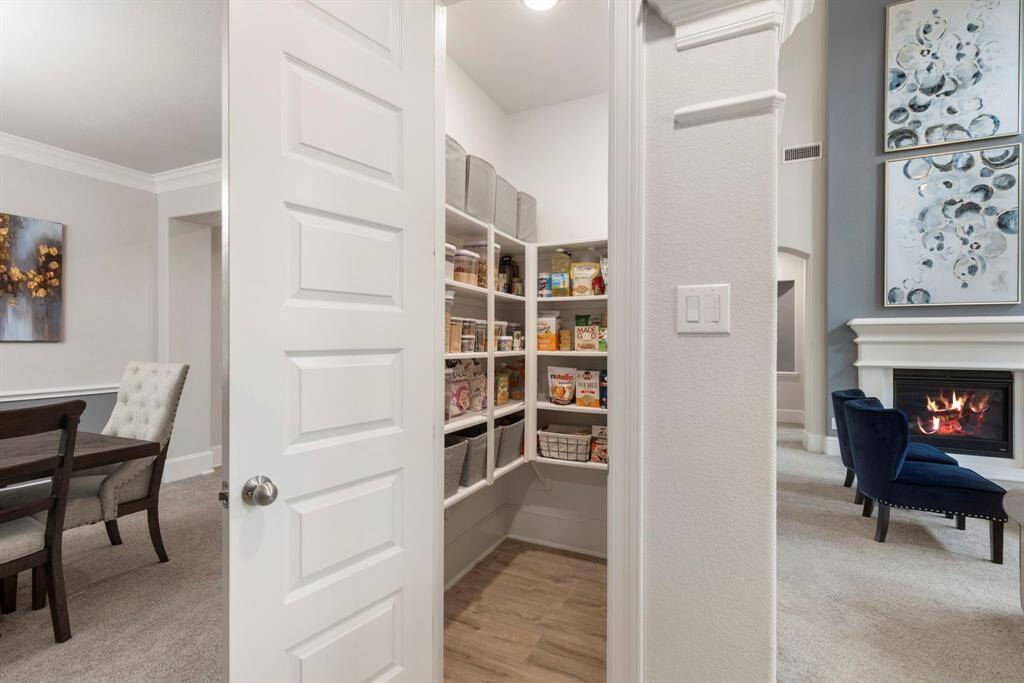 A spacious walk-in pantry is perfectly placed in the kitchen.