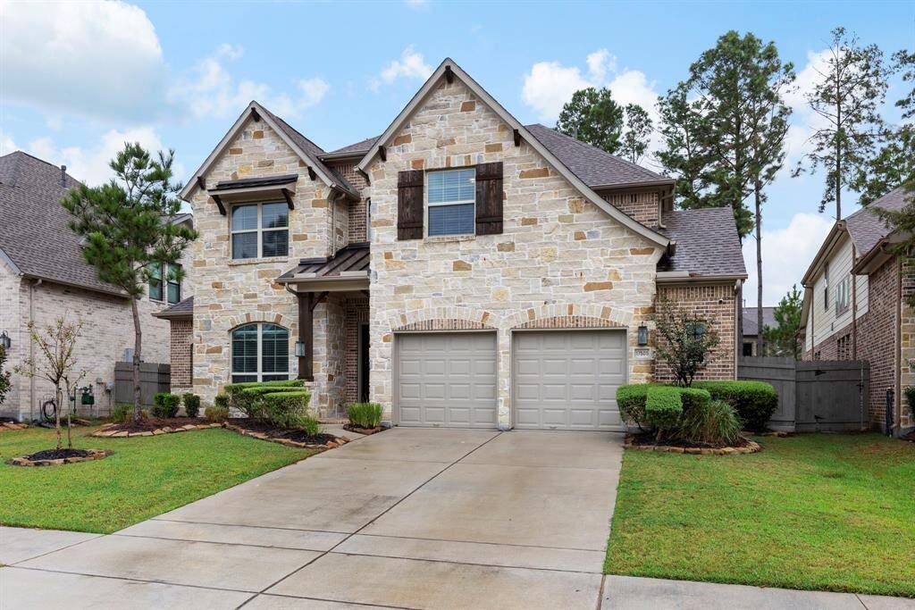 Double wide driveway to the oversized garage.