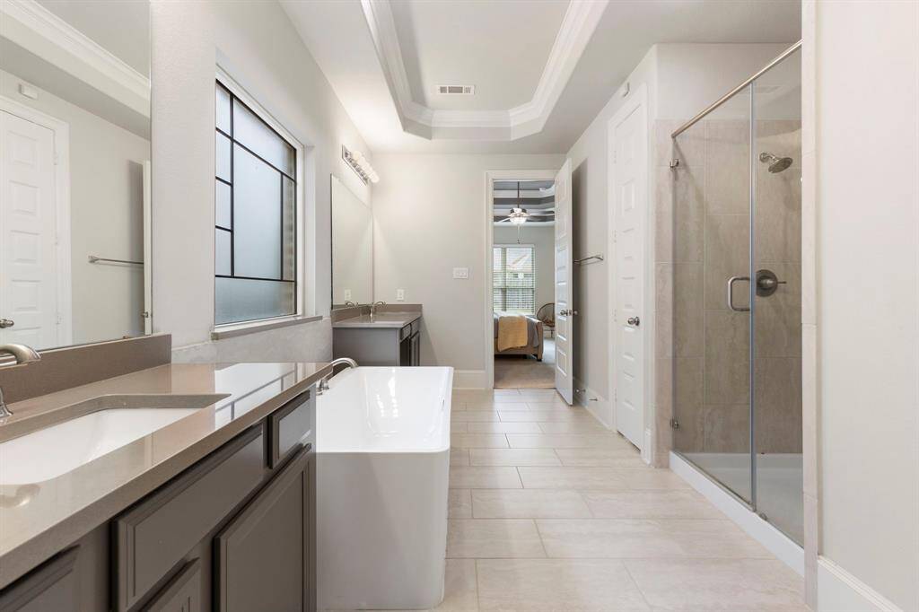 The Primary bathroom is the path between the bedroom to the closet.