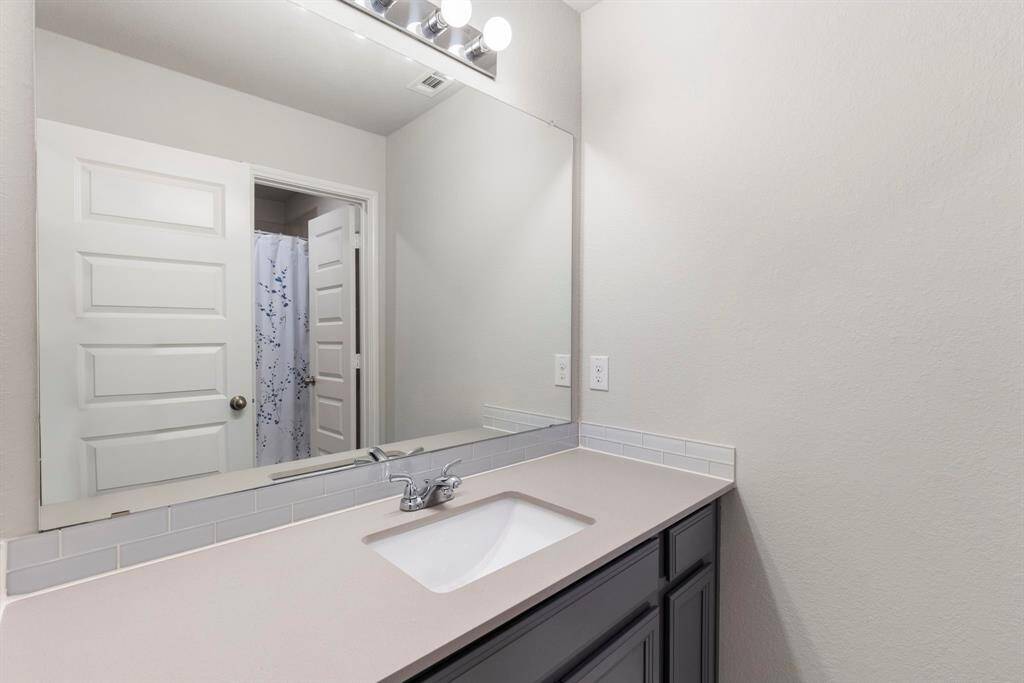 This Secondary bathroom has a separate vanity from the Tub/Shower & toilet area.  It is located between two of the Secondary bedrooms and is easy access from the game room/media room.
