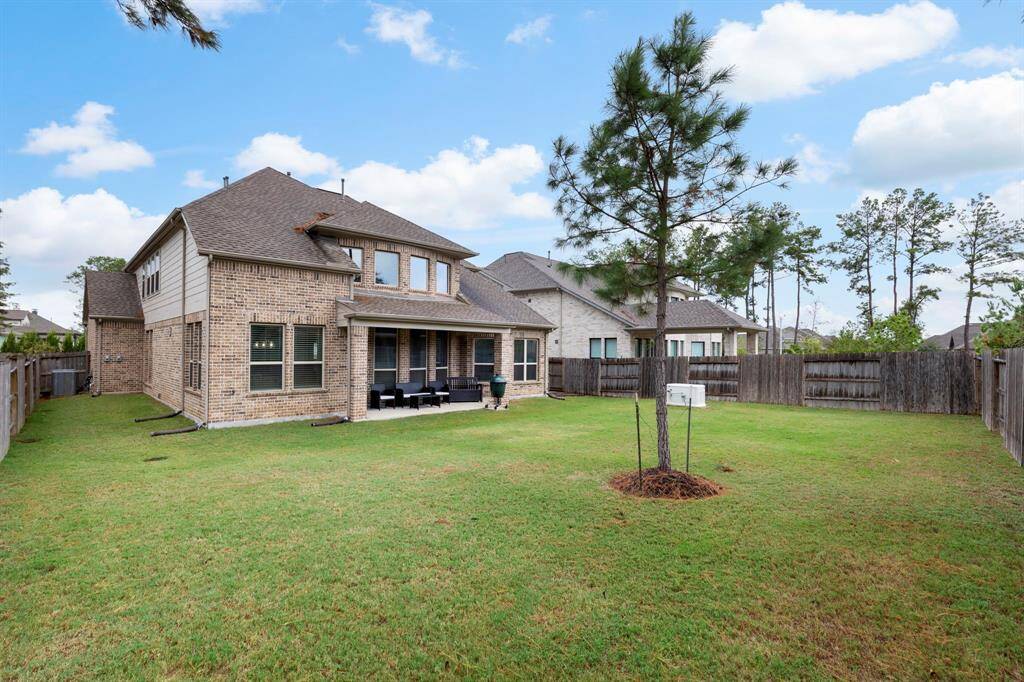 The fully fenced backyard is nice size.