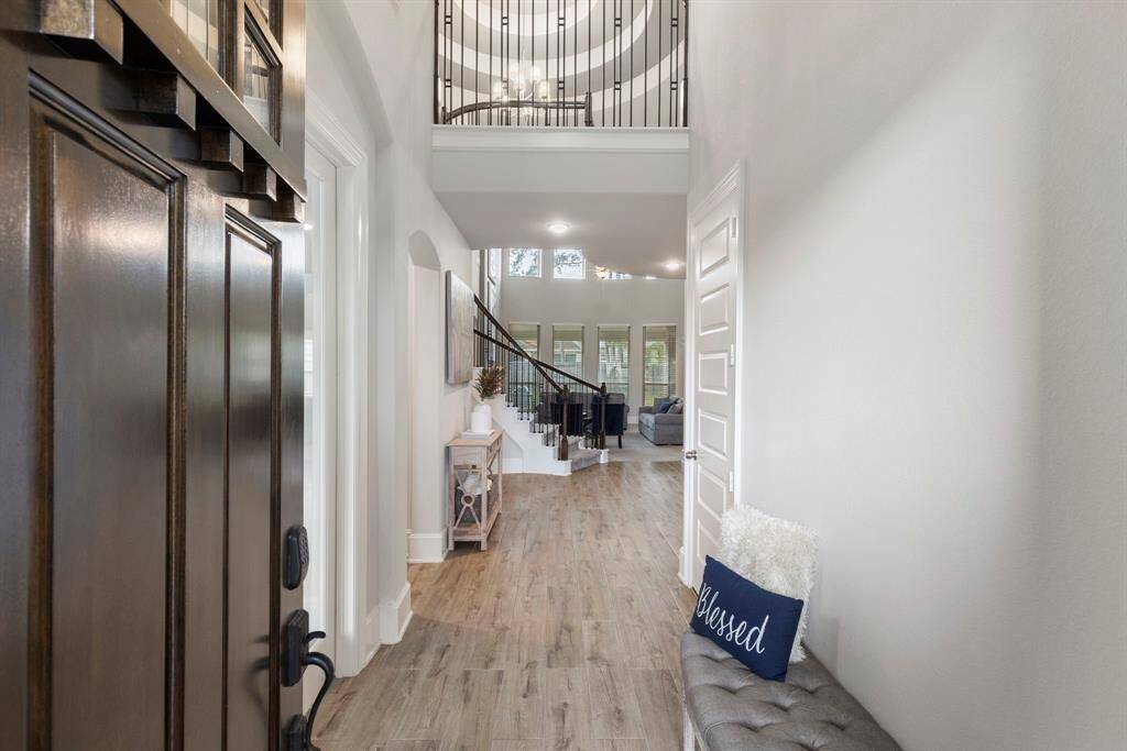 As you enter into this stunning Preston home, you are welcomed by the stunning entry into the rotunda and wrought iron spiral staircase.