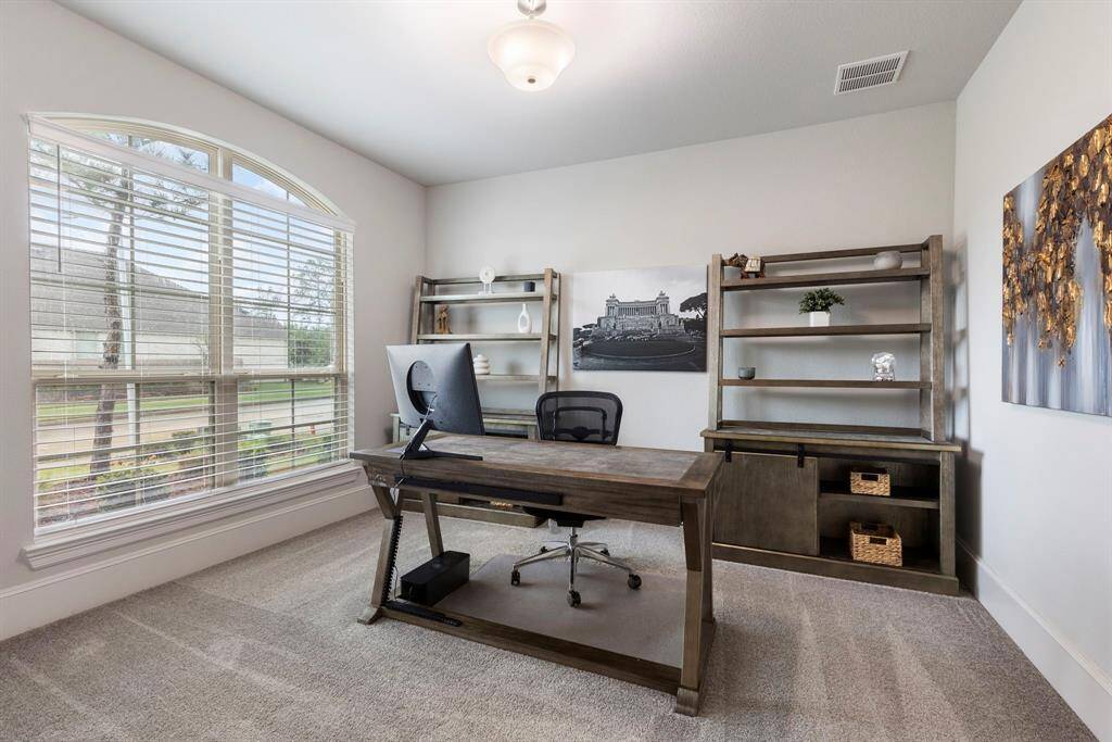 As you enter into the home, the study is located at the front looking into the front yard.  It has double glass doors for added privacy and large windows for lots of natural light.