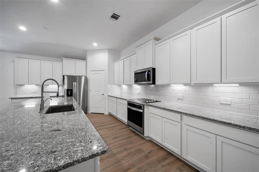 Kitchen with ample counterspace and cabinet storage.