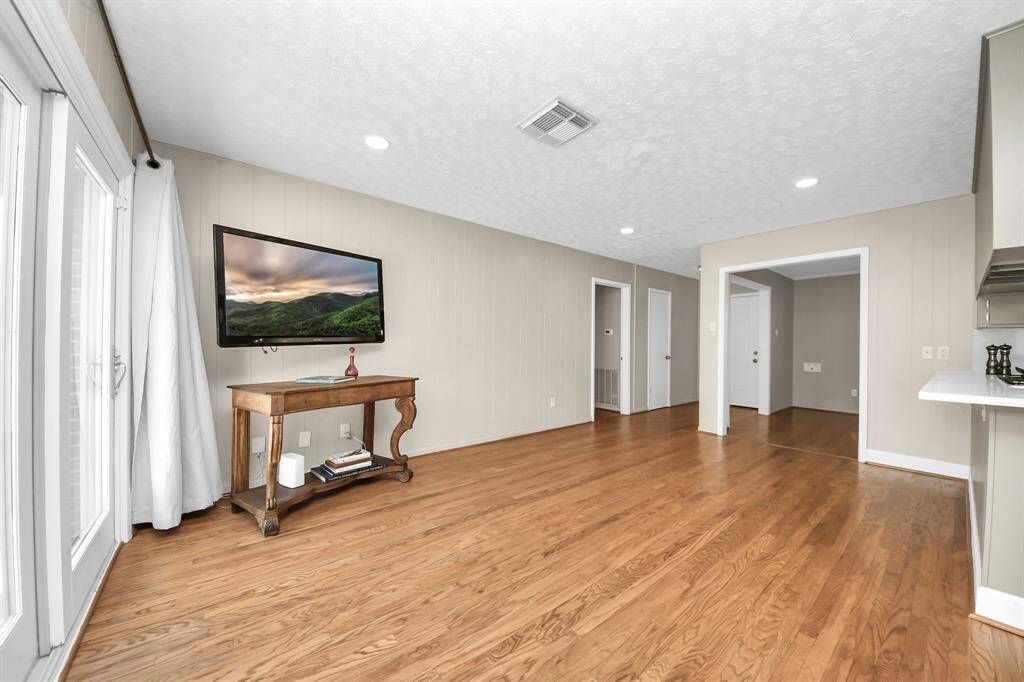 Spacious family room featuring a convenient TV wall mount.