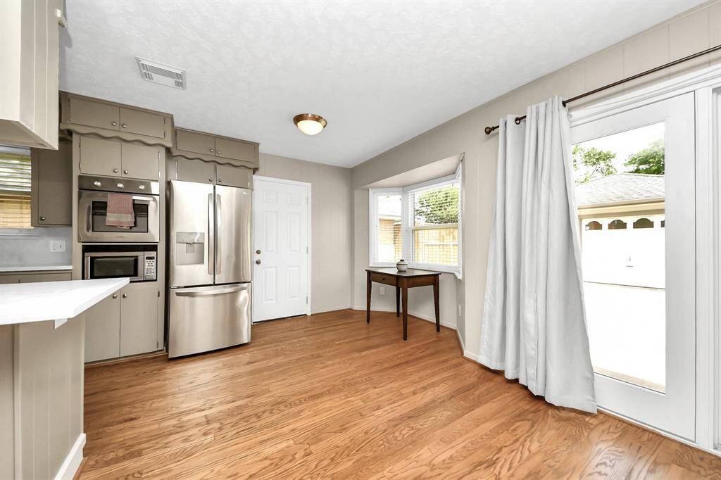 Direct access from the family room and kitchen to the driveway enhances convenience.