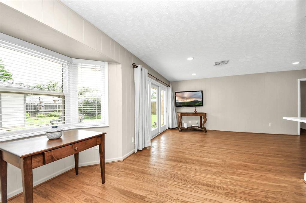 A bright kitchen seamlessly opens to a cozy breakfast area, perfect for family gatherings.