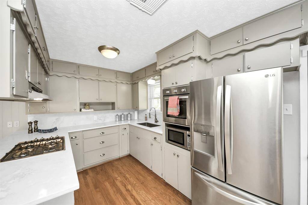 Modern kitchen featuring sleek, energy-efficient stainless steel appliances.