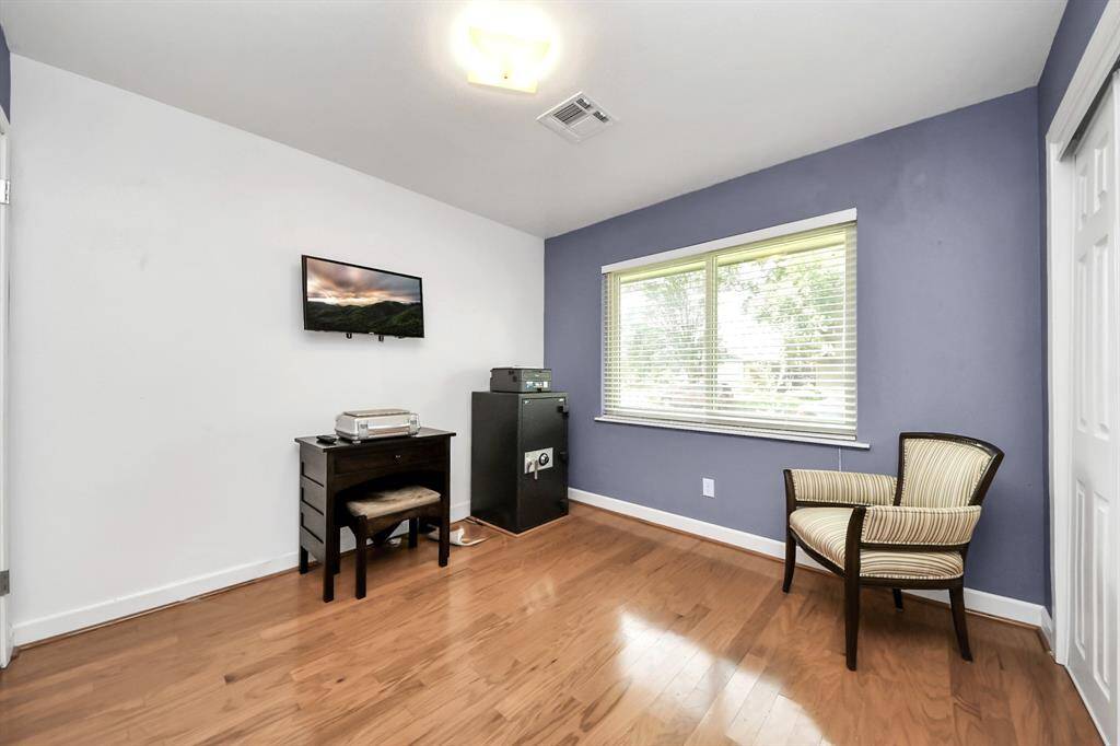 Bedroom 1 ---This versatile room offers a stunning front yard view, perfect for use as a bedroom or office.