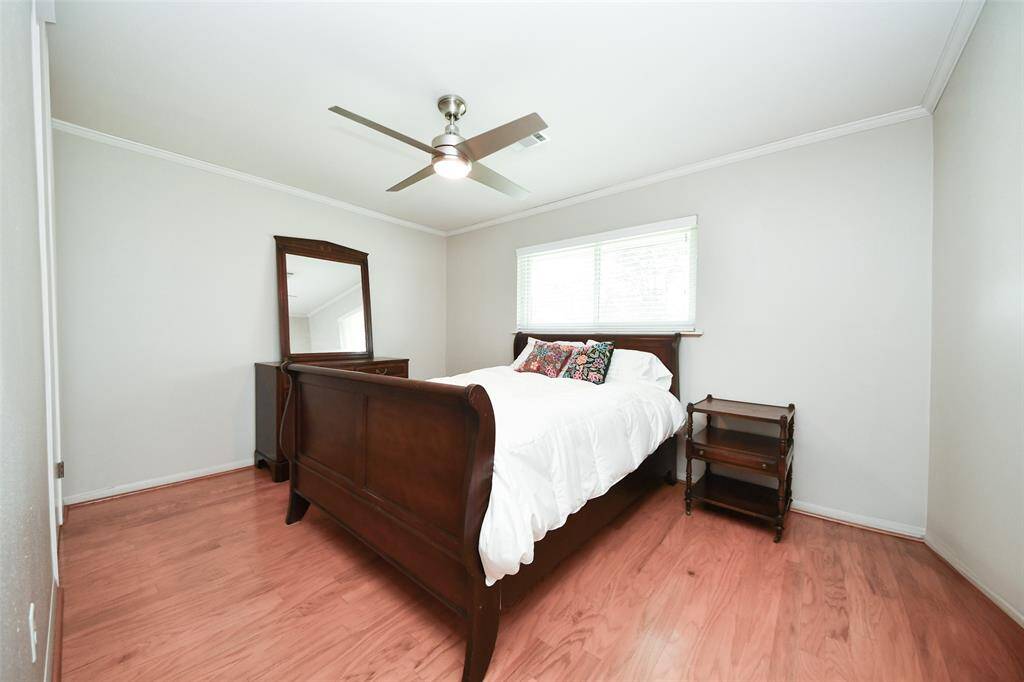 Bedroom 2 -Enjoy abundant natural light and serene views of the beautifully landscaped yard.