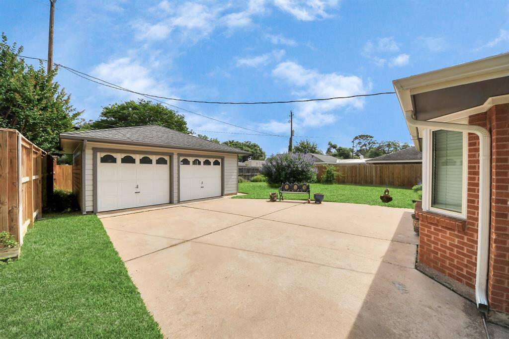 Spacious detached garage for two cars.