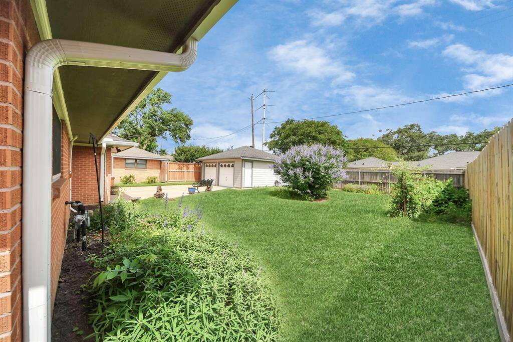 Experience serene garden views from the patio, with a charming flower bed nestled below the master bedroom.