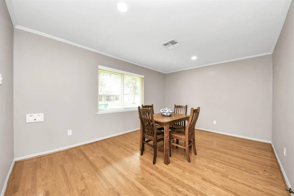 Warm and versatile dining room, perfect for formal gatherings or cozy living space.