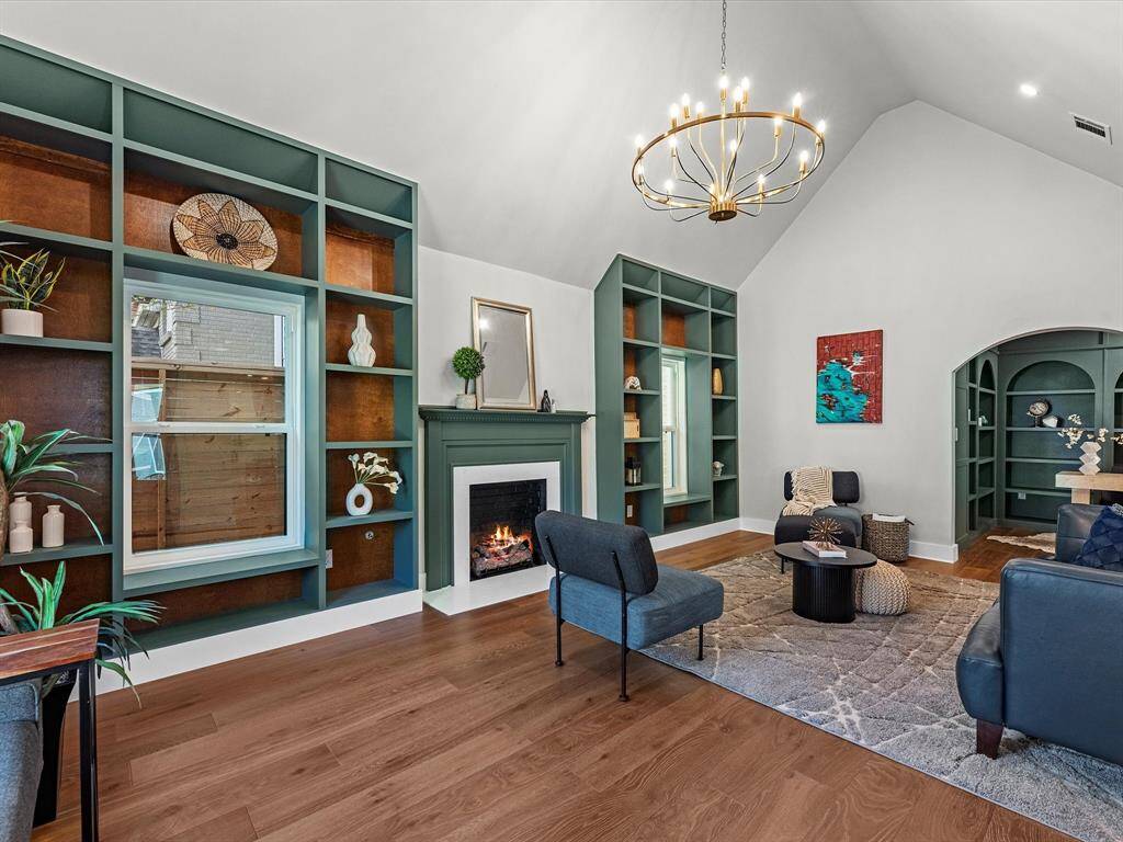 Features new windows and a statement designer chandelier for a modern, elegant touch.