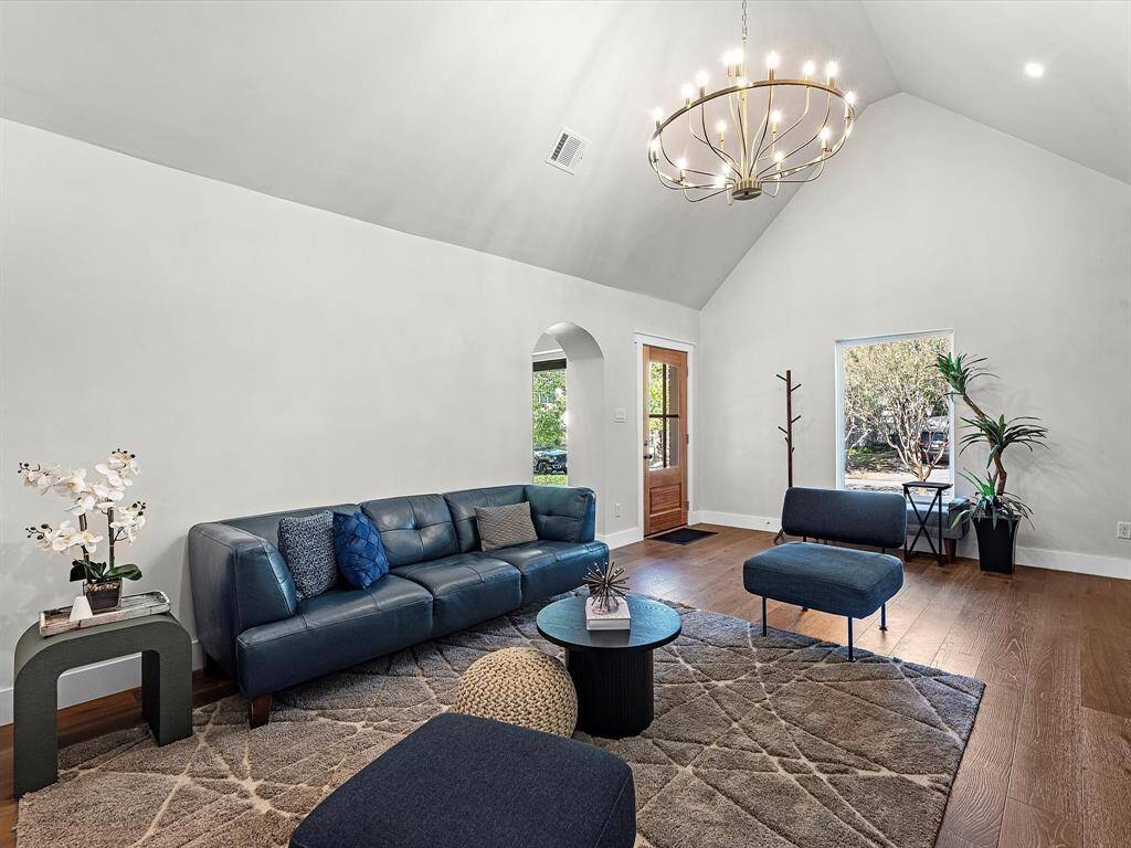 The main living area is bright and airy, featuring a large picture window that brings in natural light and plenty of wall space to design to your liking.