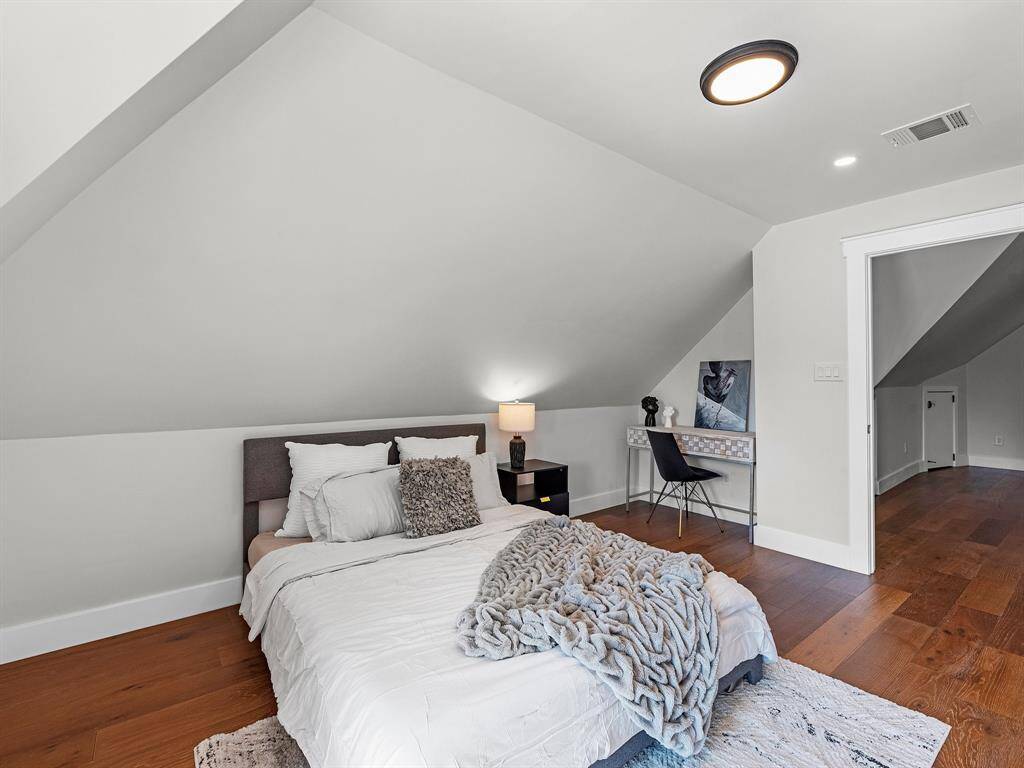 The upstairs third bedroom includes a versatile niche, perfect for additional storage or creating a functional desk space.