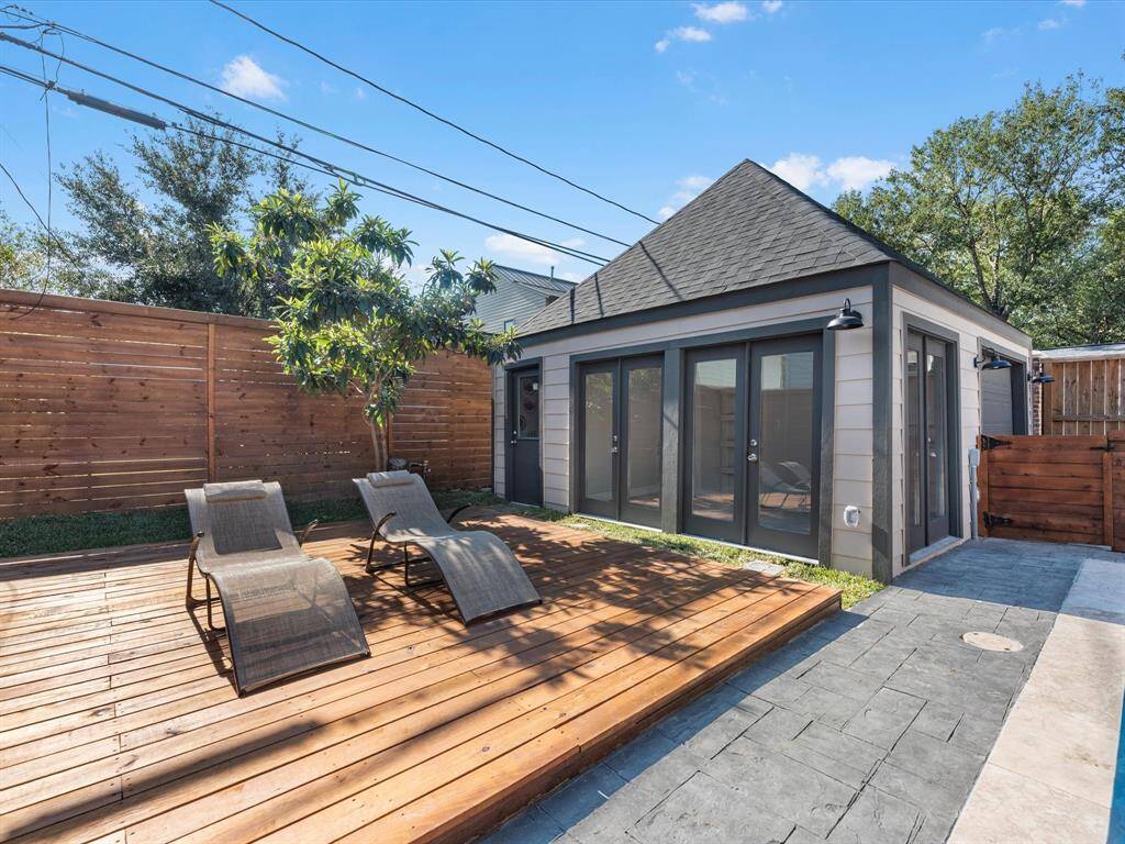 The pool house offers versatile flex space, additional storage, and a full bathroom, making it ideal for entertaining, a home office, or guest accommodations.