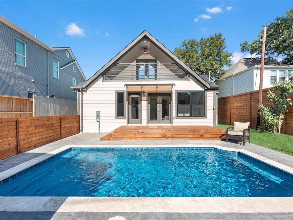 New pavers surround the replastered pool, featuring updated lighting and decorative tiles for a refreshed look.