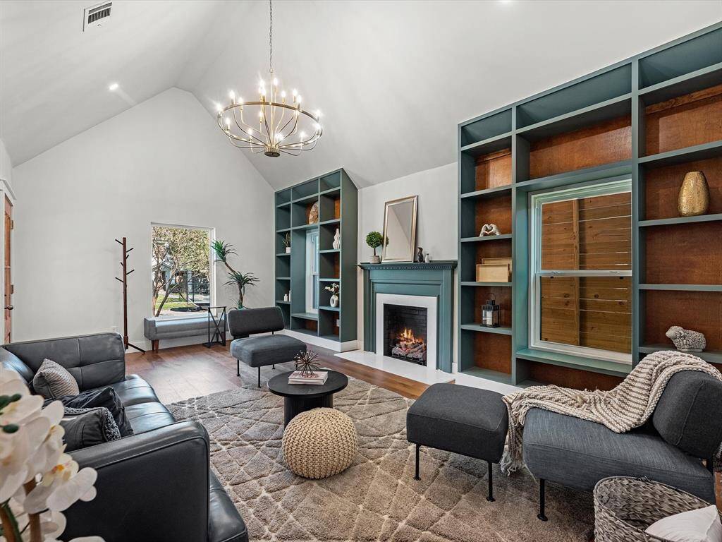 As you enter, you’re greeted by soaring raised ceilings, custom shelving, and stunning White Oak wood floors, creating a warm and inviting atmosphere.