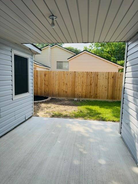 Covered Porch - Side yard off the Living Area via French doors.