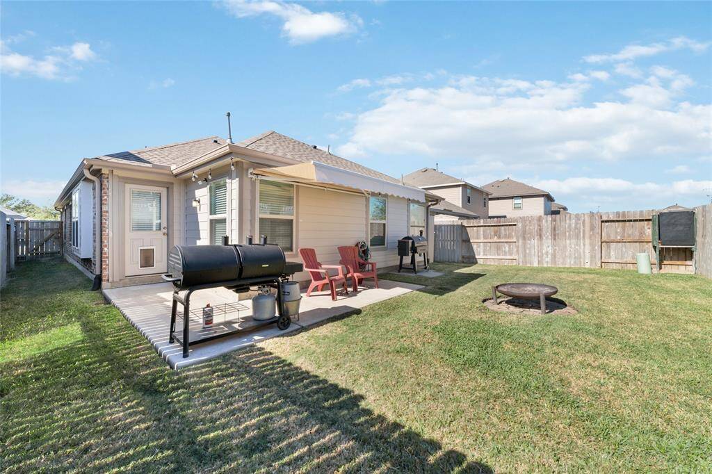 Beautiful backyard for entertaining with extra patio area and an awning for shade