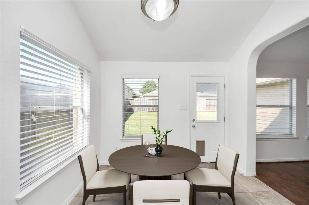 Charming breakfast nook with natural light—perfect for morning coffee or casual meals. (virtually staged)