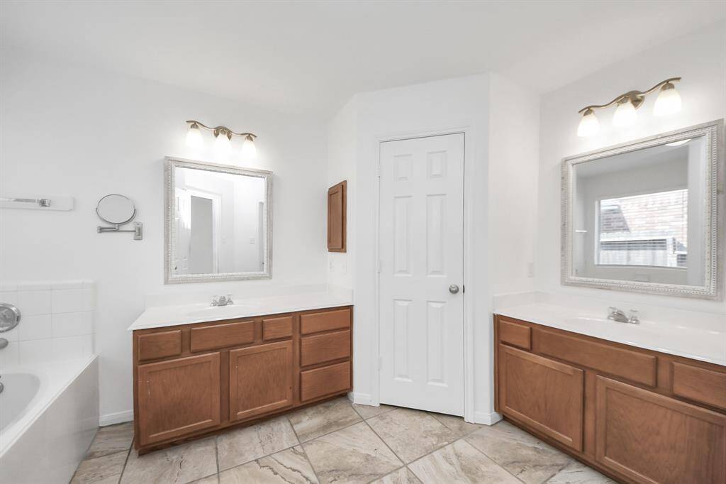 Dual vanities in the en-suite provide personal space and comfort.