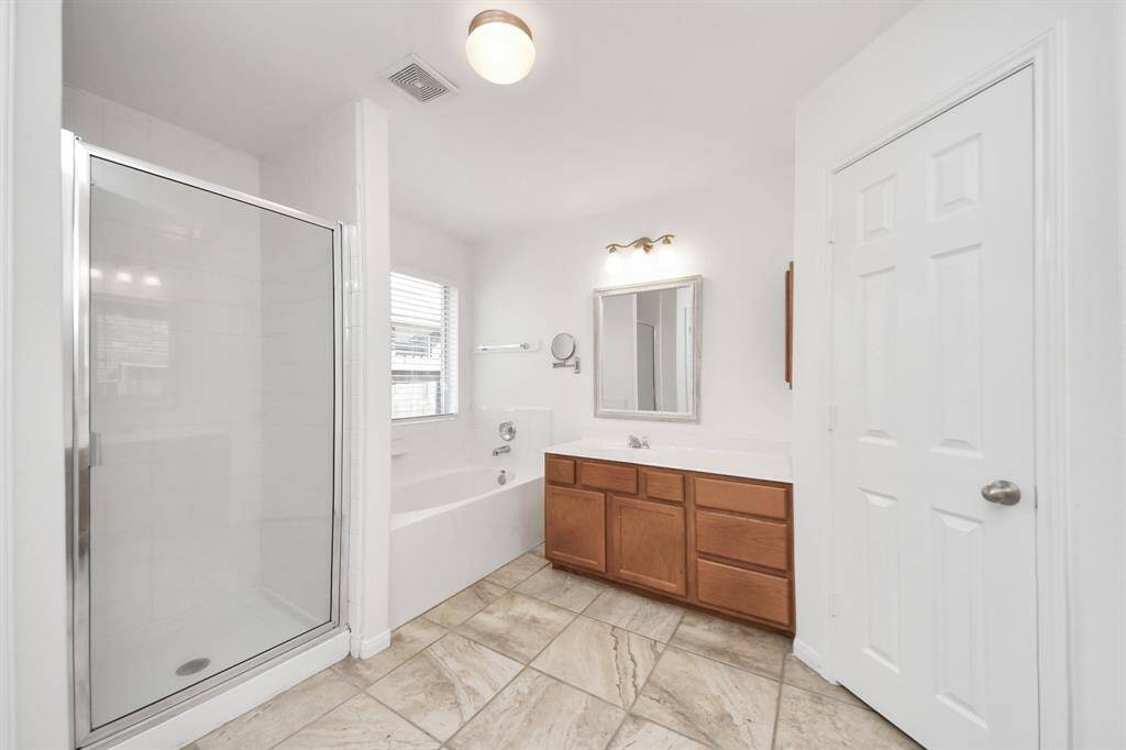 Enjoy a spa-like experience with both a walk-in shower and deep soaking tub.