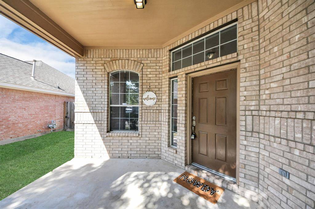 Covered front entry with space to sit and relax—true Southern charm with a warm welcome.