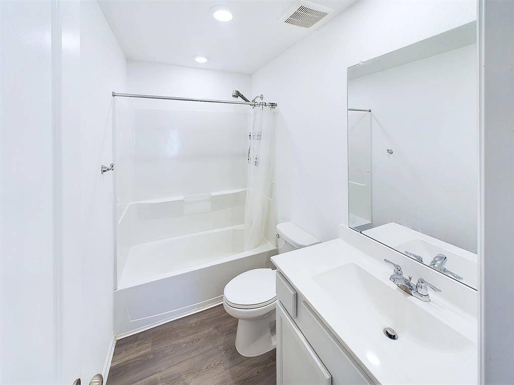 One of two full bathrooms upstairs.