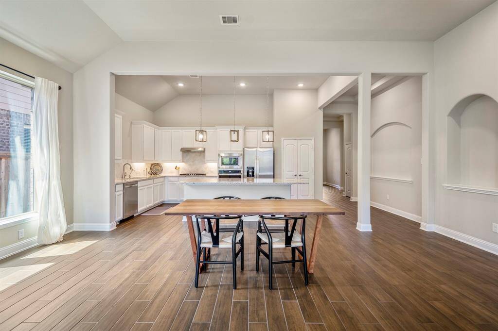Another look at this beautiful open-concept floor plan with built-in recessed art nooks.